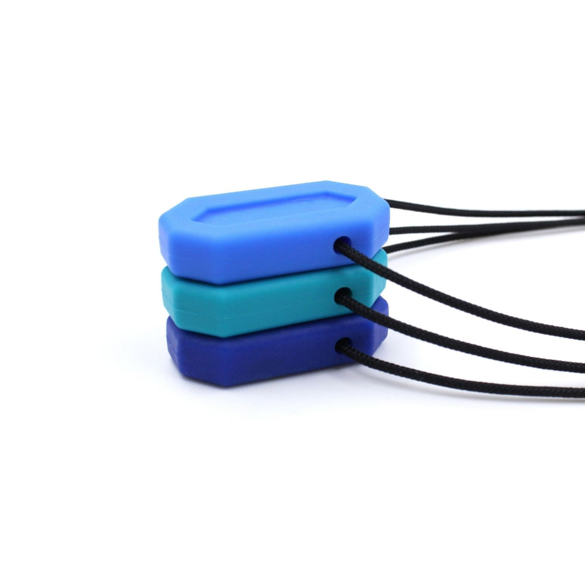 Flera MiniBite staplade för storleksjämförelse, ca 4 cm höga