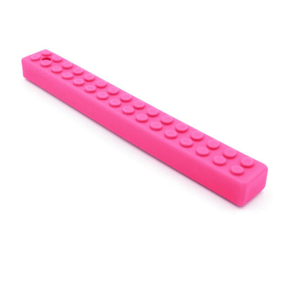Rosa MEGA Brick Stick med knottrig yta för varierad sensorisk stimulans.
