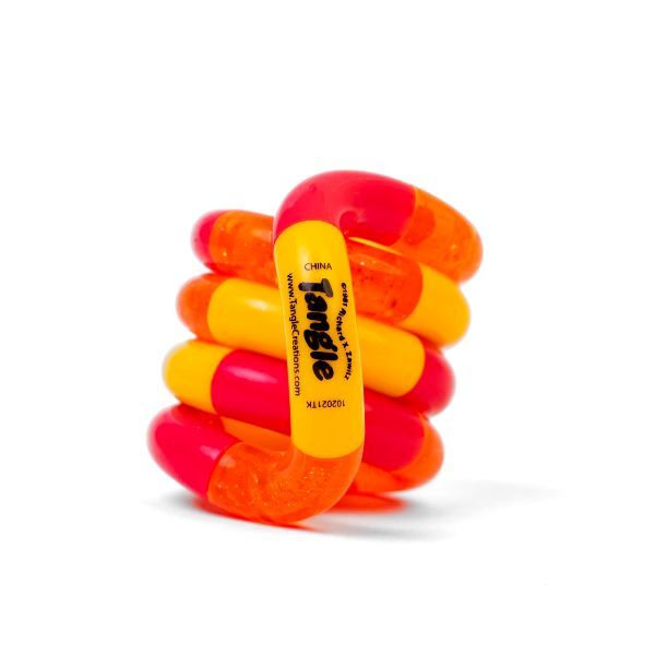 Fidget-leksak i livliga gula och orange nyanser med glitterdetaljer. Skapar ett taktilt och visuellt stimulerande intryck.