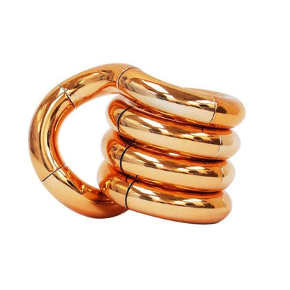 Tangle Jr Metallic i guld – stilren fidgetleksak för rastlösa händer