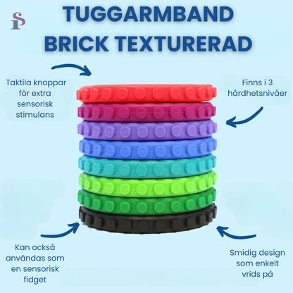 Flera Tuggarmband Brick i olika färger, staplade för att visa textur och storlek.